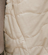 Beige double-breasted trench coat